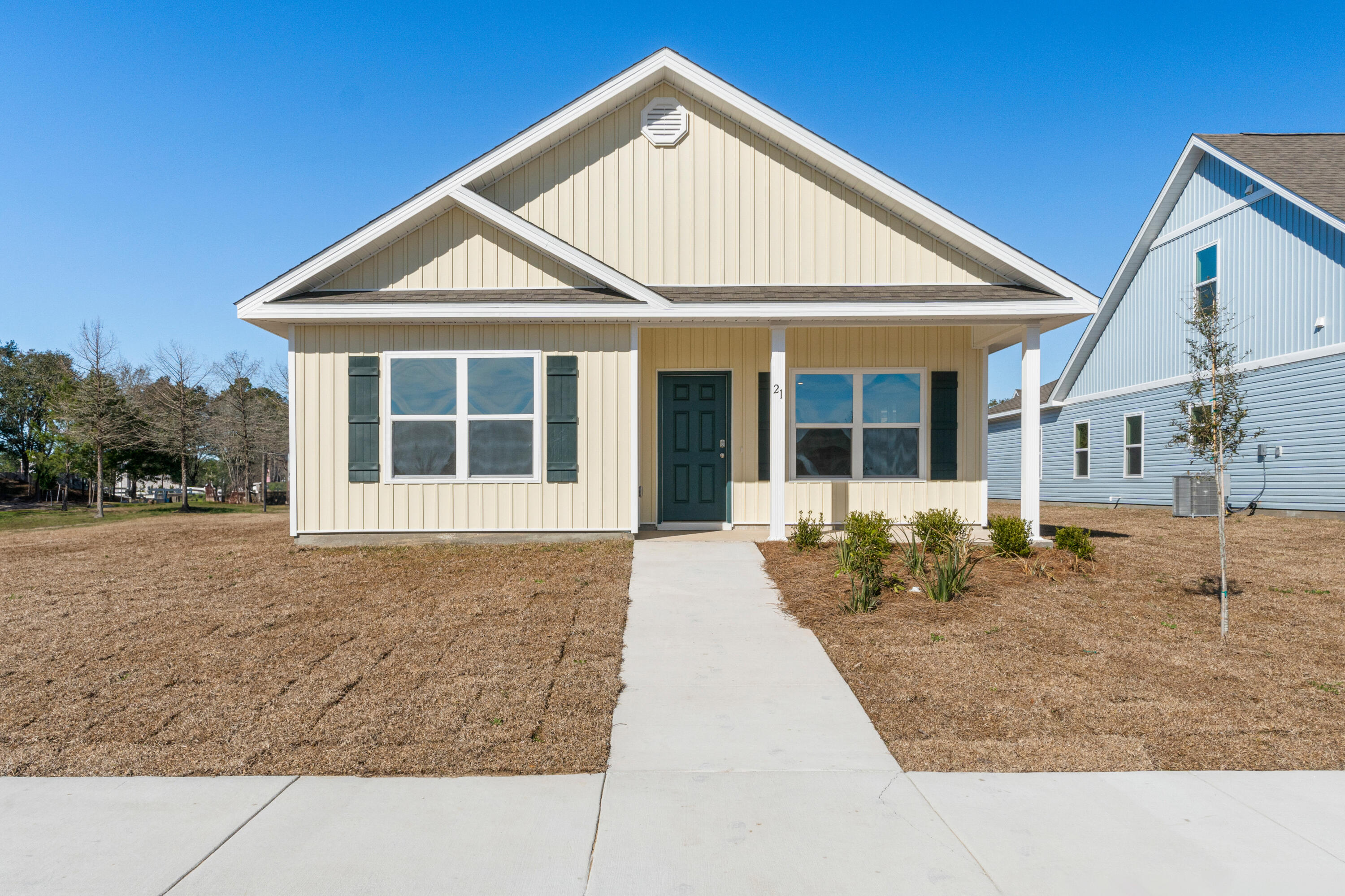 a view of front a house with a yard