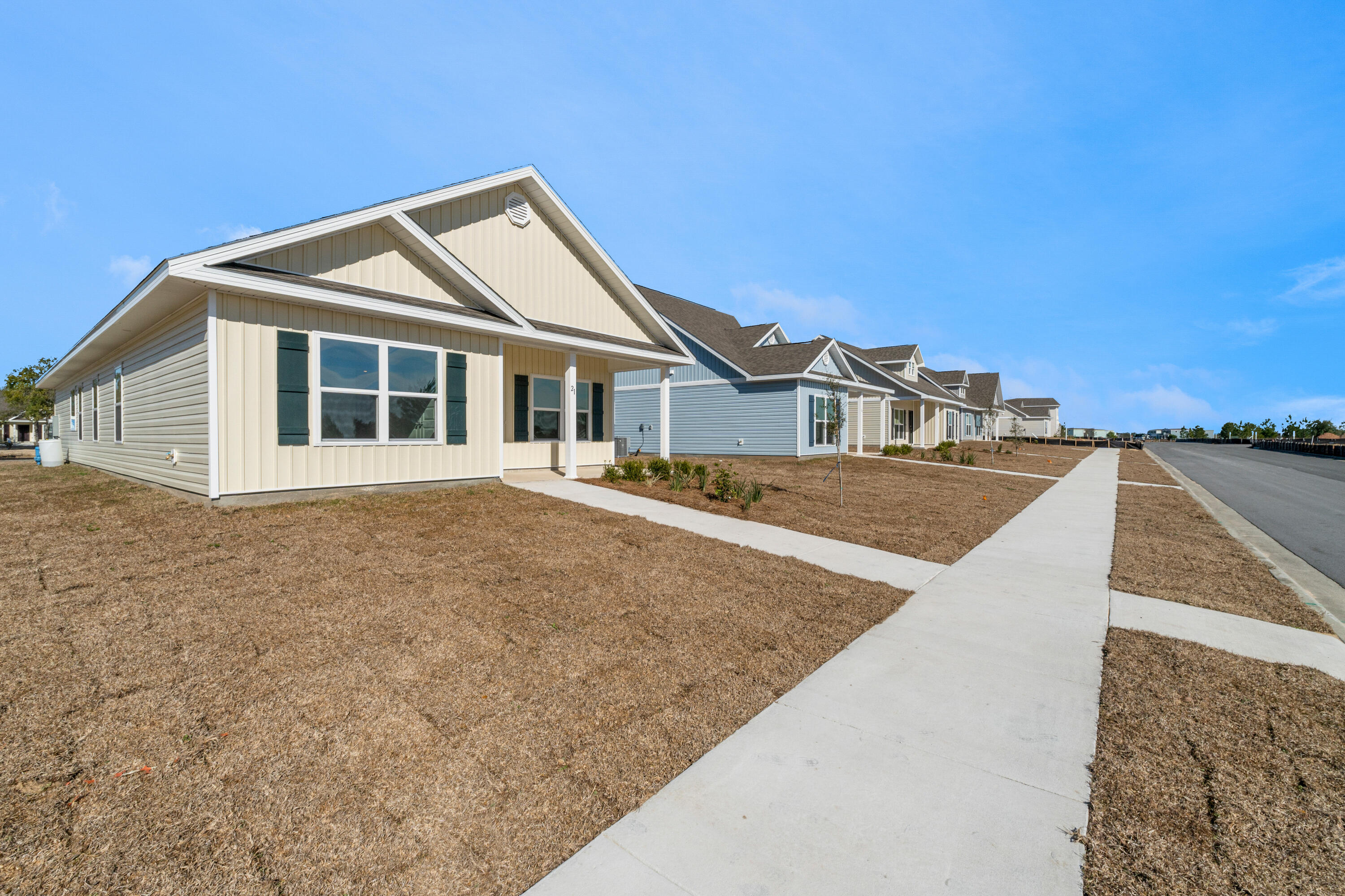 123 Staggerbush Street Freeport, FL 32439 - Photo 2 of 24 a front view of a house with a yard