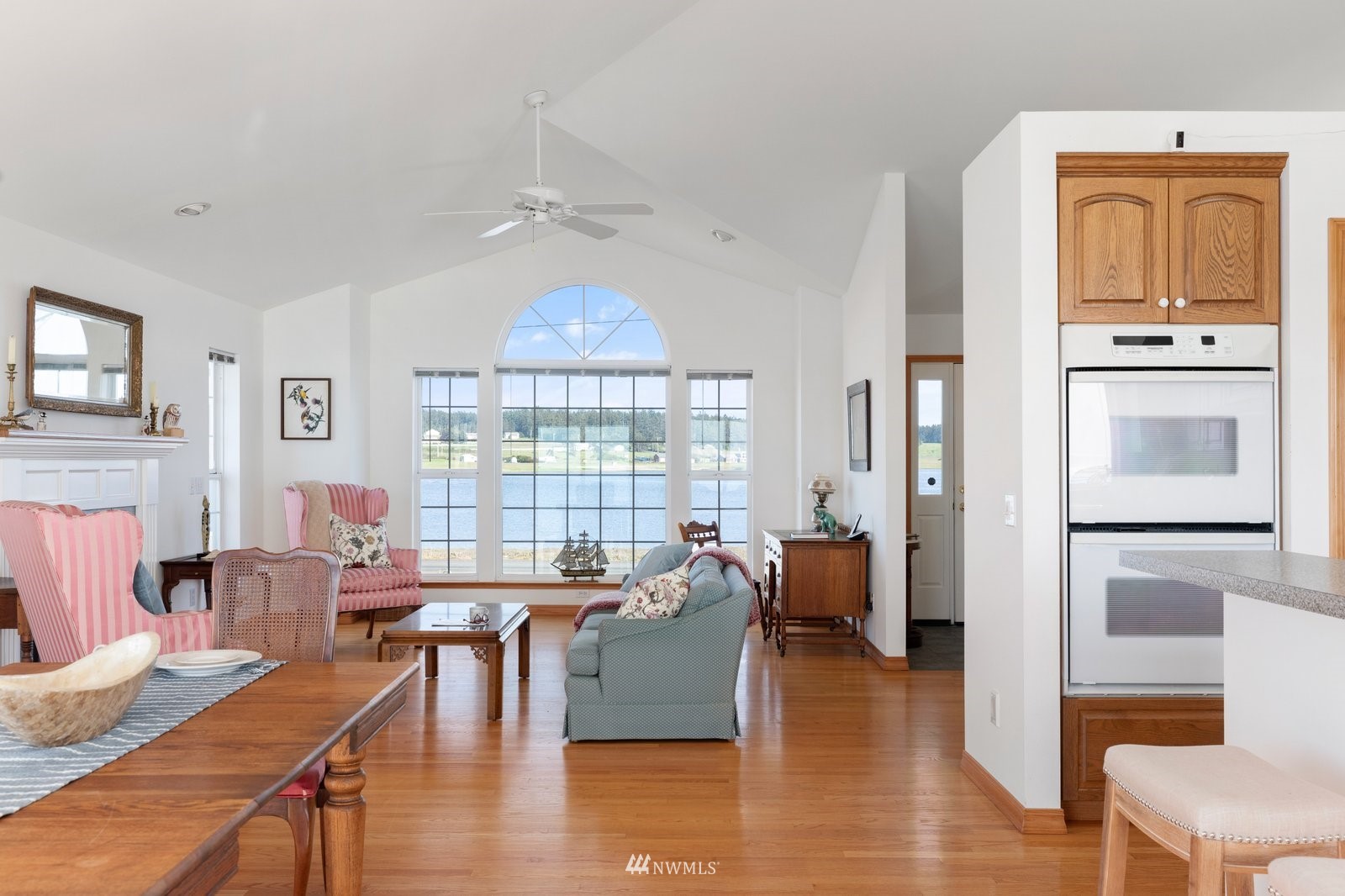 2585 West Beach Road Oak Harbor, WA 98277 - Photo 21 of 38 a living room with furniture and a wooden floor