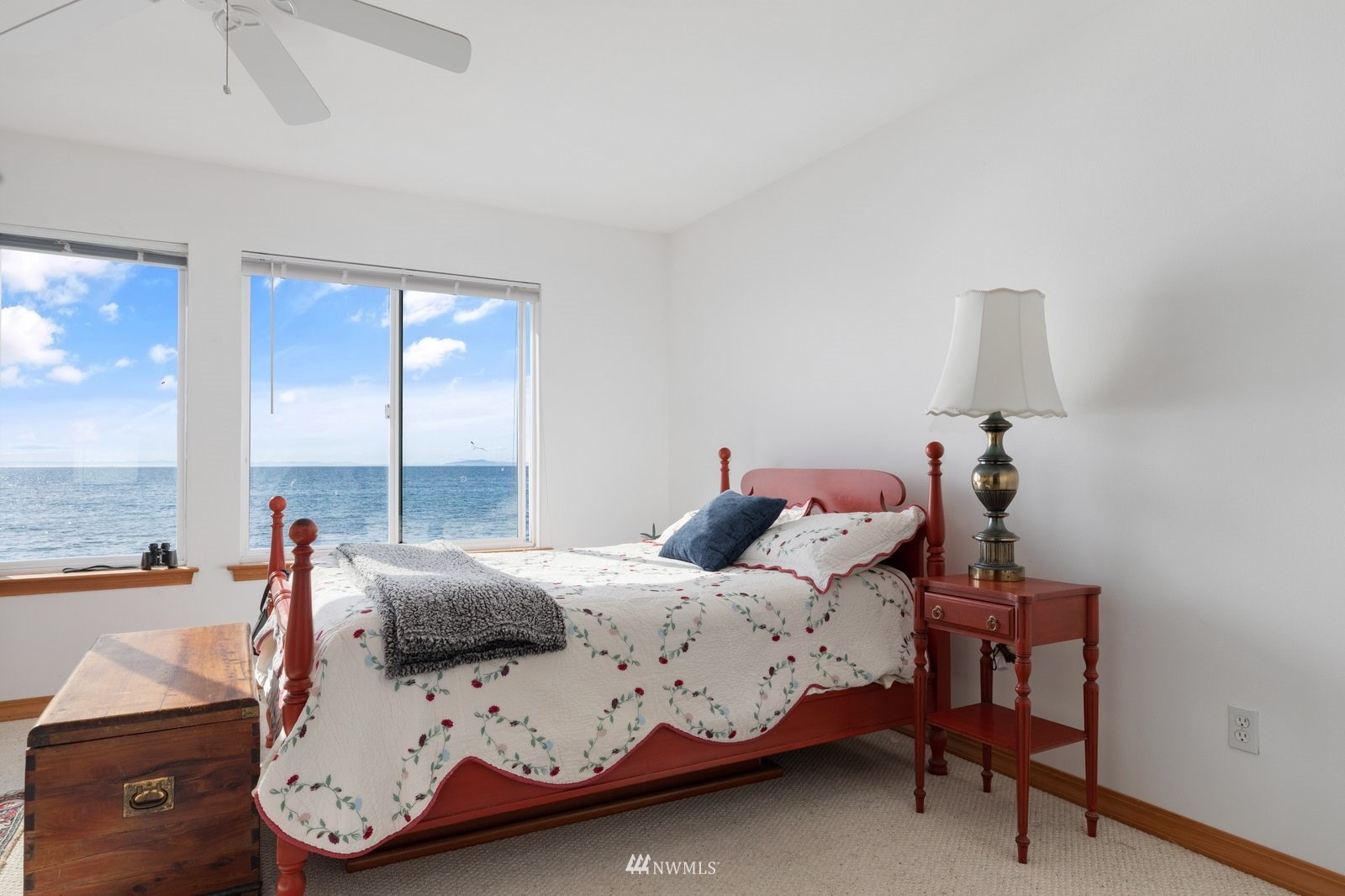 2585 West Beach Road Oak Harbor, WA 98277 - Photo 25 of 38 a bedroom with a bed and large windows