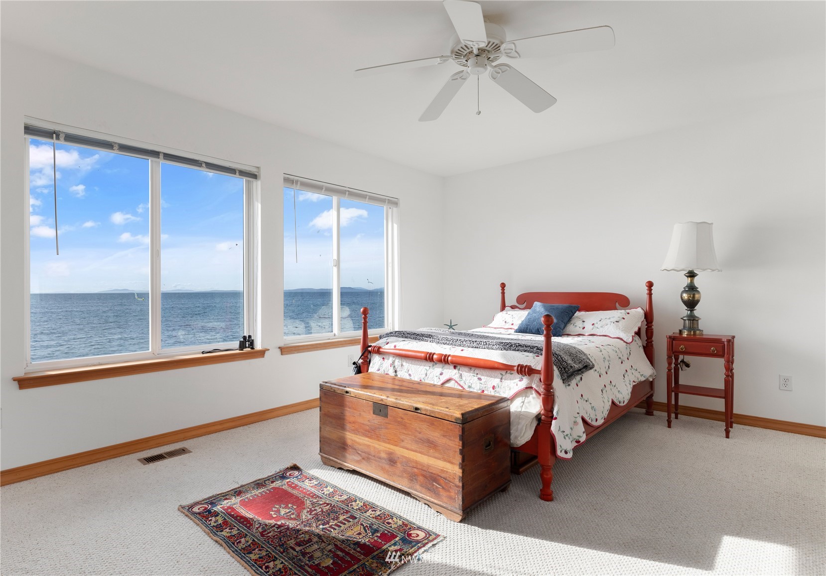 2585 West Beach Road Oak Harbor, WA 98277 - Photo 26 of 38 a bed room with a bed and a window