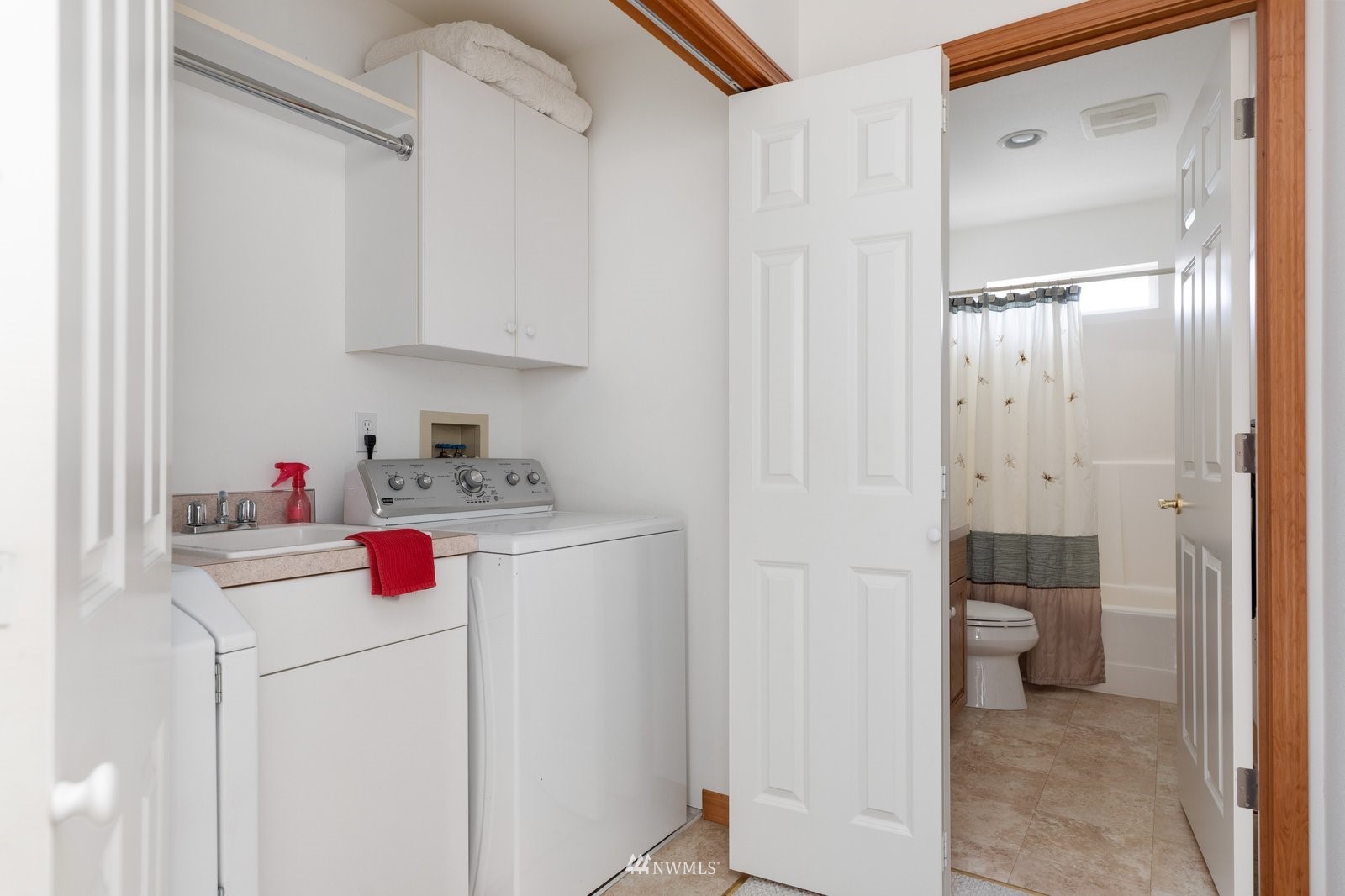 2585 West Beach Road Oak Harbor, WA 98277 - Photo 29 of 38 a room with white cabinets and white appliances