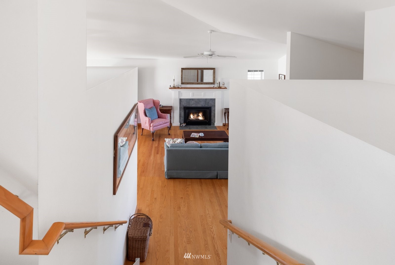 2585 West Beach Road Oak Harbor, WA 98277 - Photo 32 of 38 a living room with furniture and a fireplace
