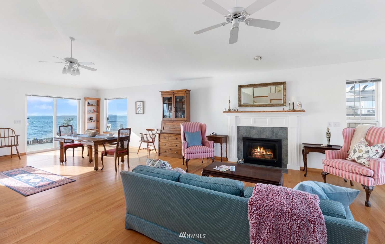 2585 West Beach Road Oak Harbor, WA 98277 - Photo 6 of 38 a living room with furniture and a fireplace