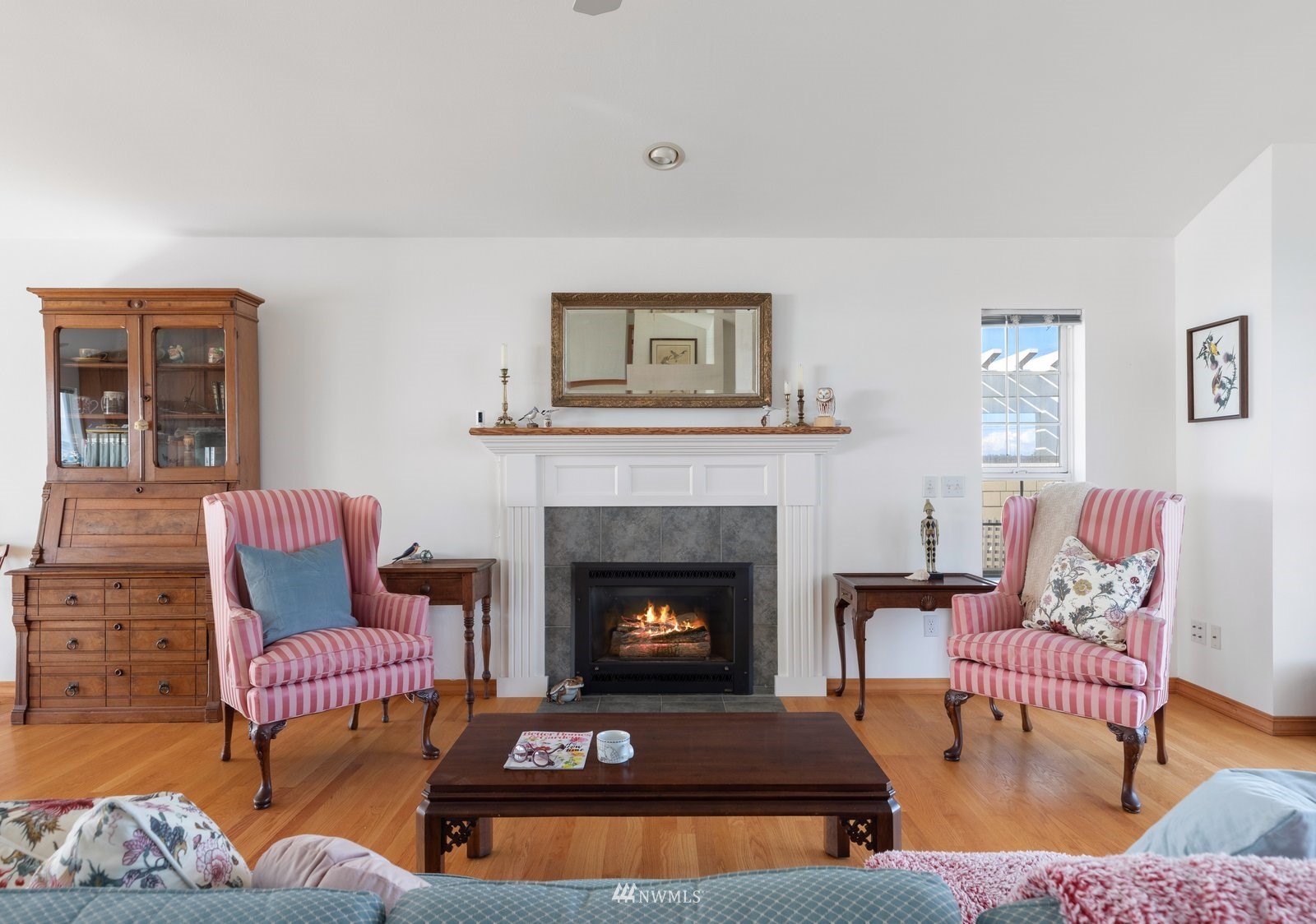 2585 West Beach Road Oak Harbor, WA 98277 - Photo 7 of 38 a living room with furniture and a fireplace