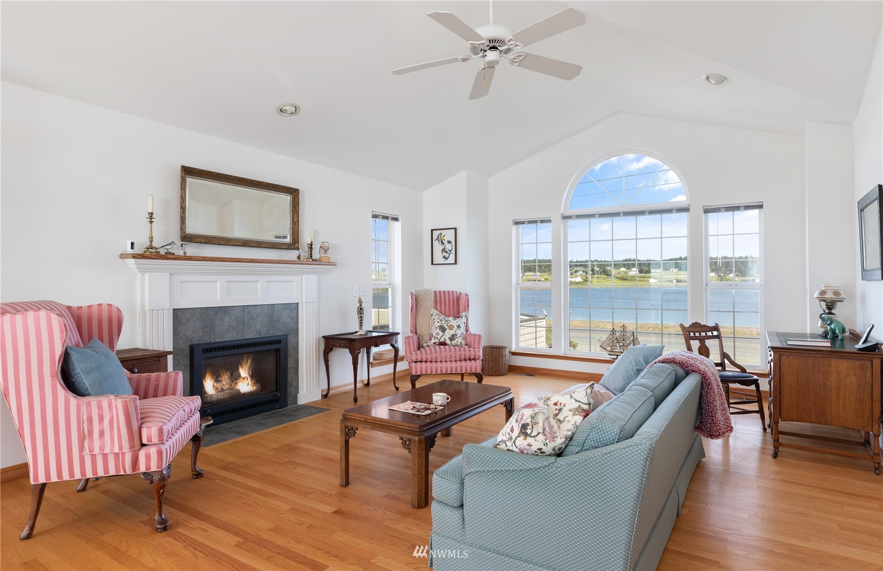 2585 West Beach Road Oak Harbor, WA 98277 - Photo 8 of 38 a living room with furniture large window and wooden floor