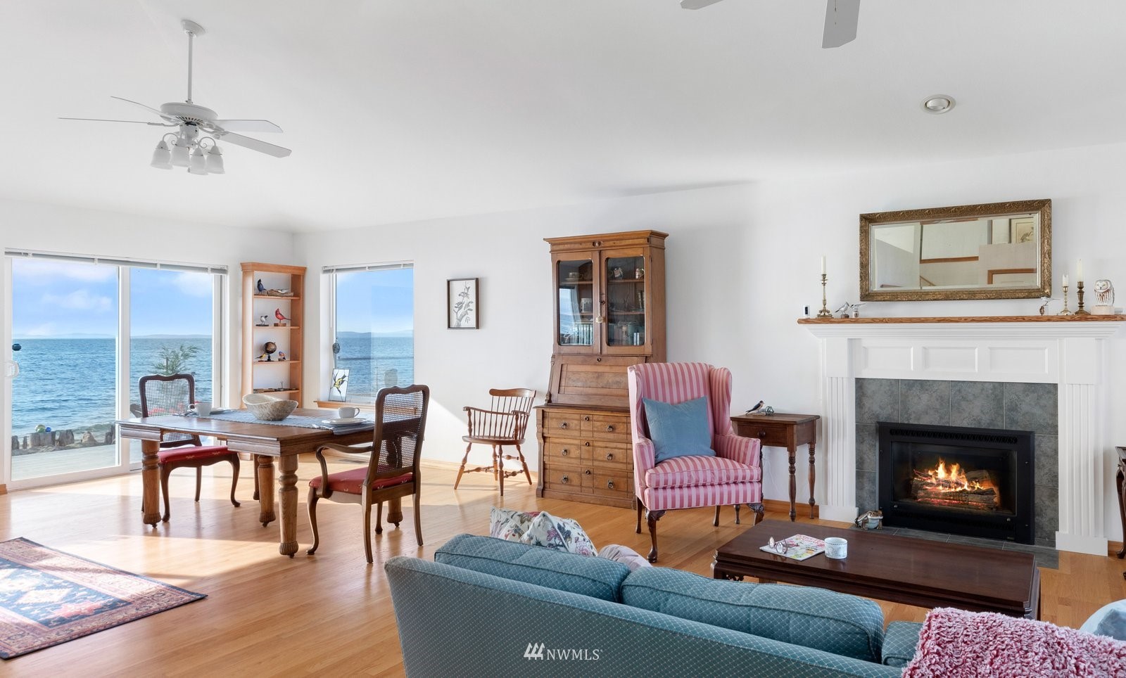 2585 West Beach Road Oak Harbor, WA 98277 - Photo 9 of 38 a living room with furniture and a fireplace