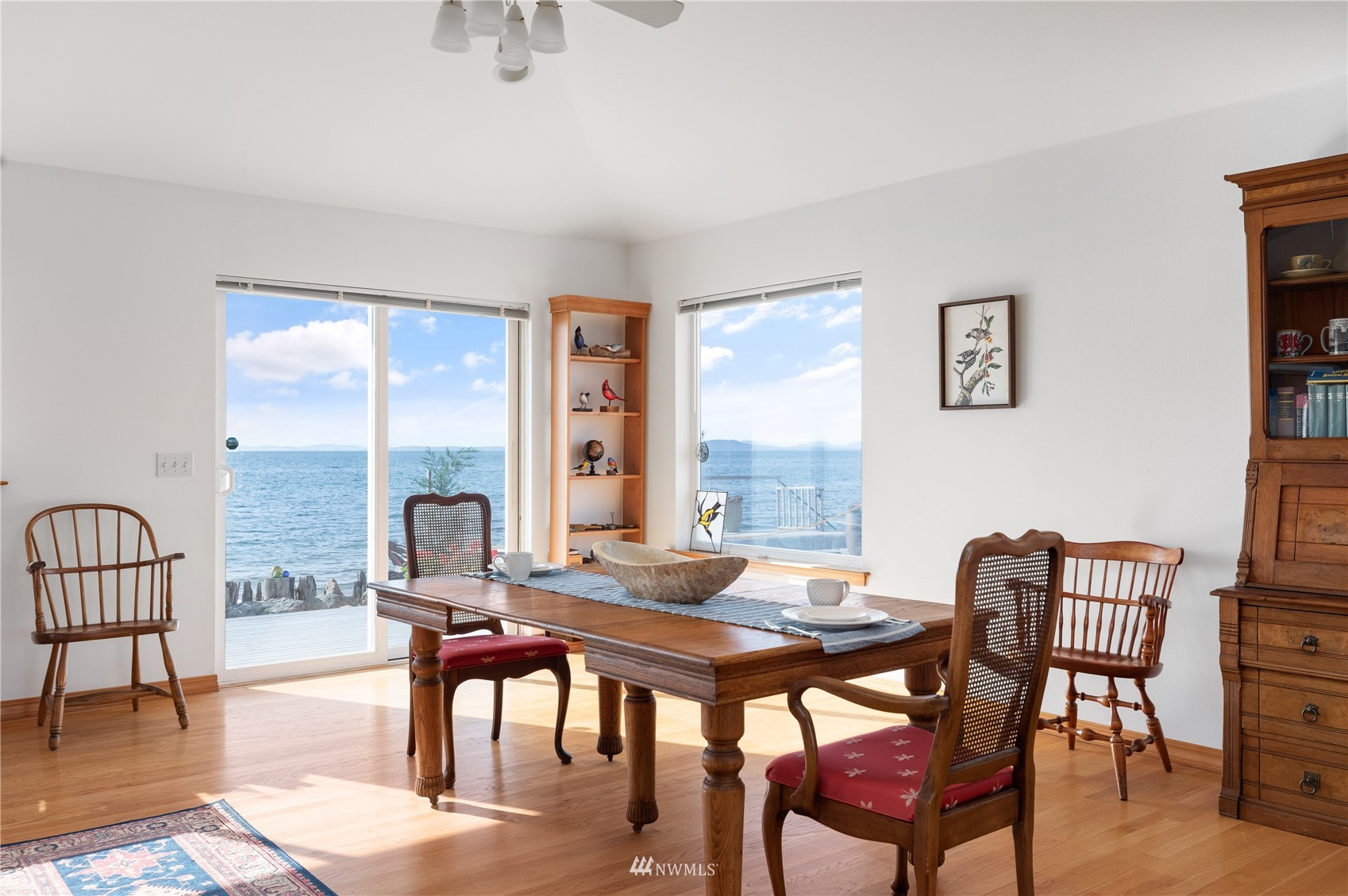 2585 West Beach Road Oak Harbor, WA 98277 - Photo 10 of 38 a view of a dining room with furniture window and wooden floor