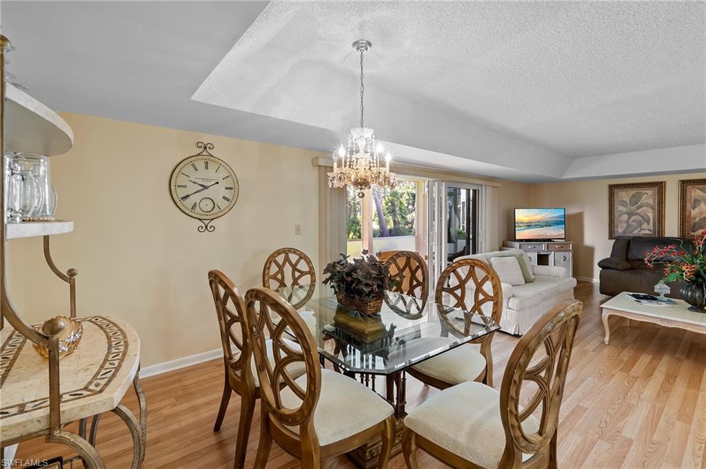 817 Teryl Road, Unit 1 Naples, FL 34112 - Photo 11 of 47 a view of a dining room with furniture window and outside view