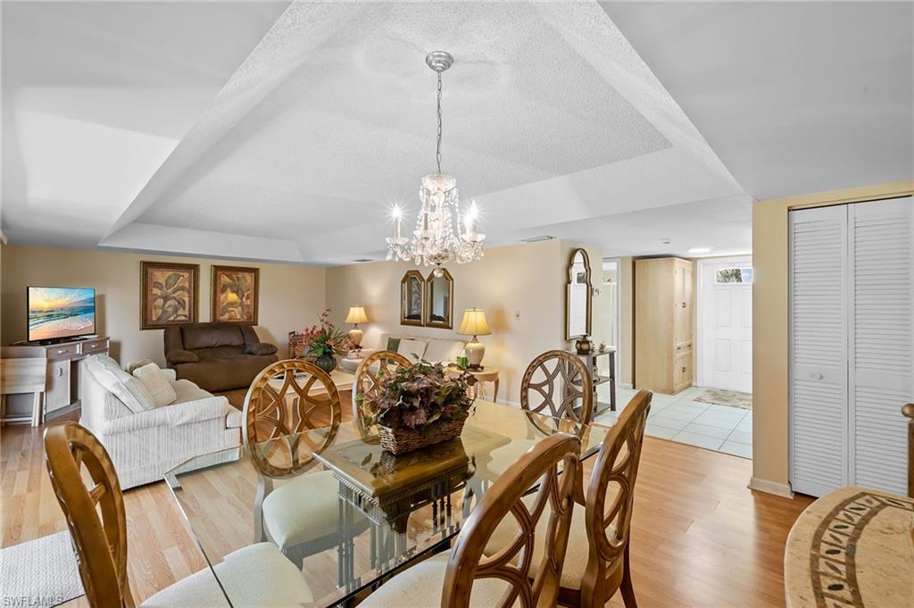 817 Teryl Road, Unit 1 Naples, FL 34112 - Photo 14 of 47 a view of a dining room with furniture window and wooden floor