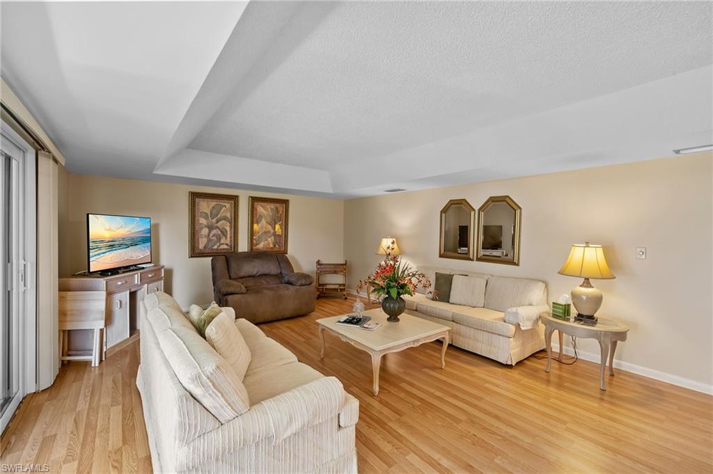 817 Teryl Road, Unit 1 Naples, FL 34112 - Photo 15 of 47 a living room with furniture and a wooden floor