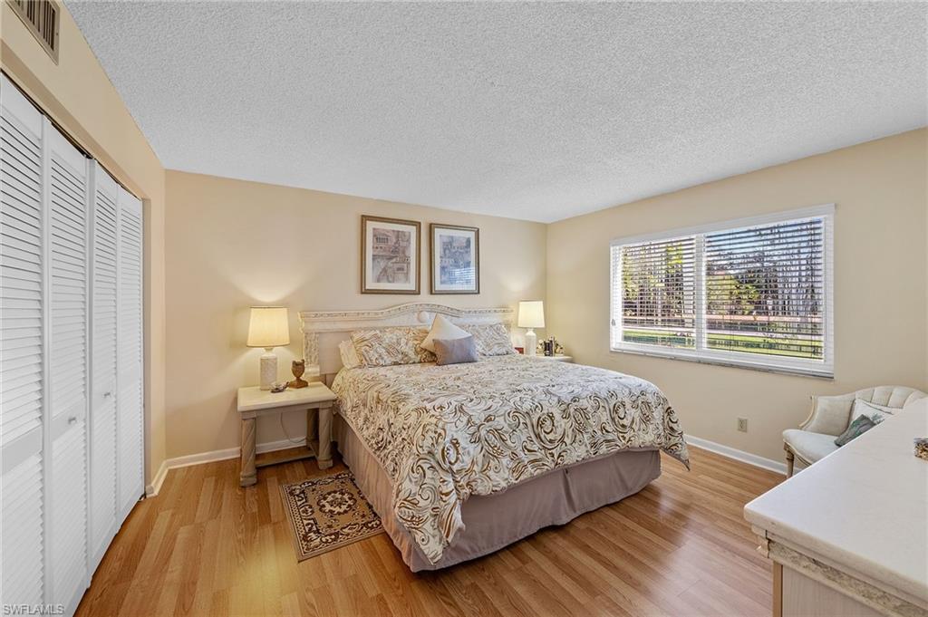817 Teryl Road, Unit 1 Naples, FL 34112 - Photo 20 of 47 a bedroom with a bed and a window