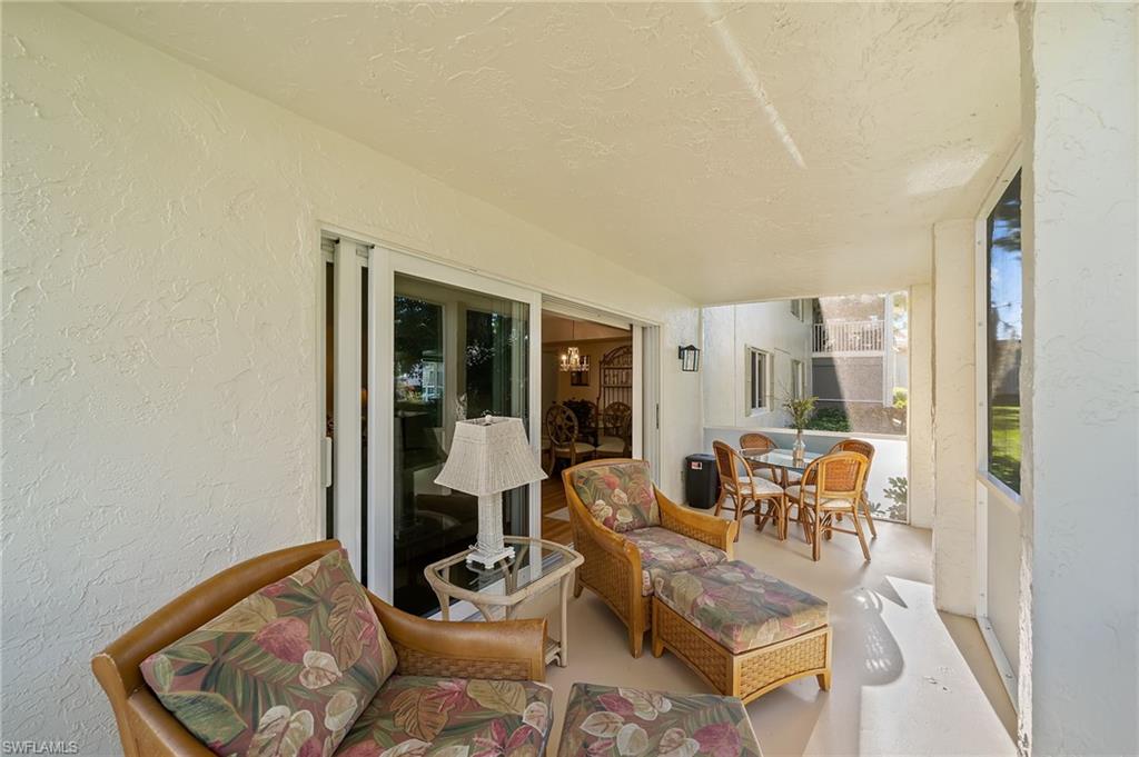 817 Teryl Road, Unit 1 Naples, FL 34112 - Photo 28 of 47 a living room with furniture and a window