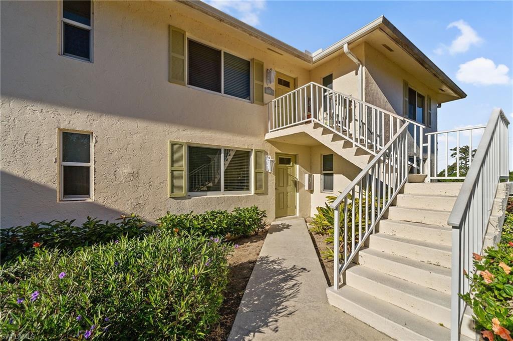 817 Teryl Road, Unit 1 Naples, FL 34112 - Photo 4 of 47 a view of a house with wooden stairs