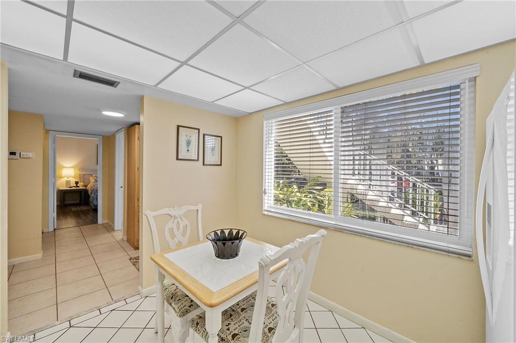 817 Teryl Road, Unit 1 Naples, FL 34112 - Photo 8 of 47 a view of kitchen with furniture and window