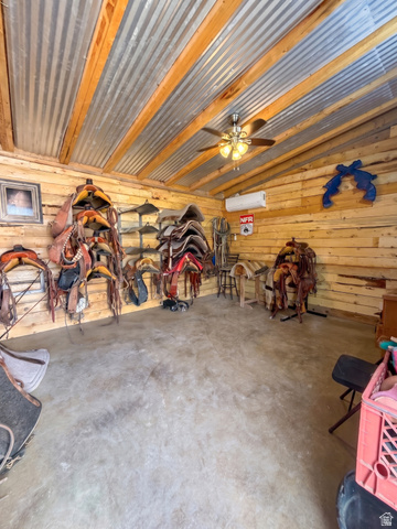 115 East 1600th Street North Santaquin, UT 84655 - Photo 47 of 52 Interior space featuring wood-paneled walls and a corrugated metal ceiling