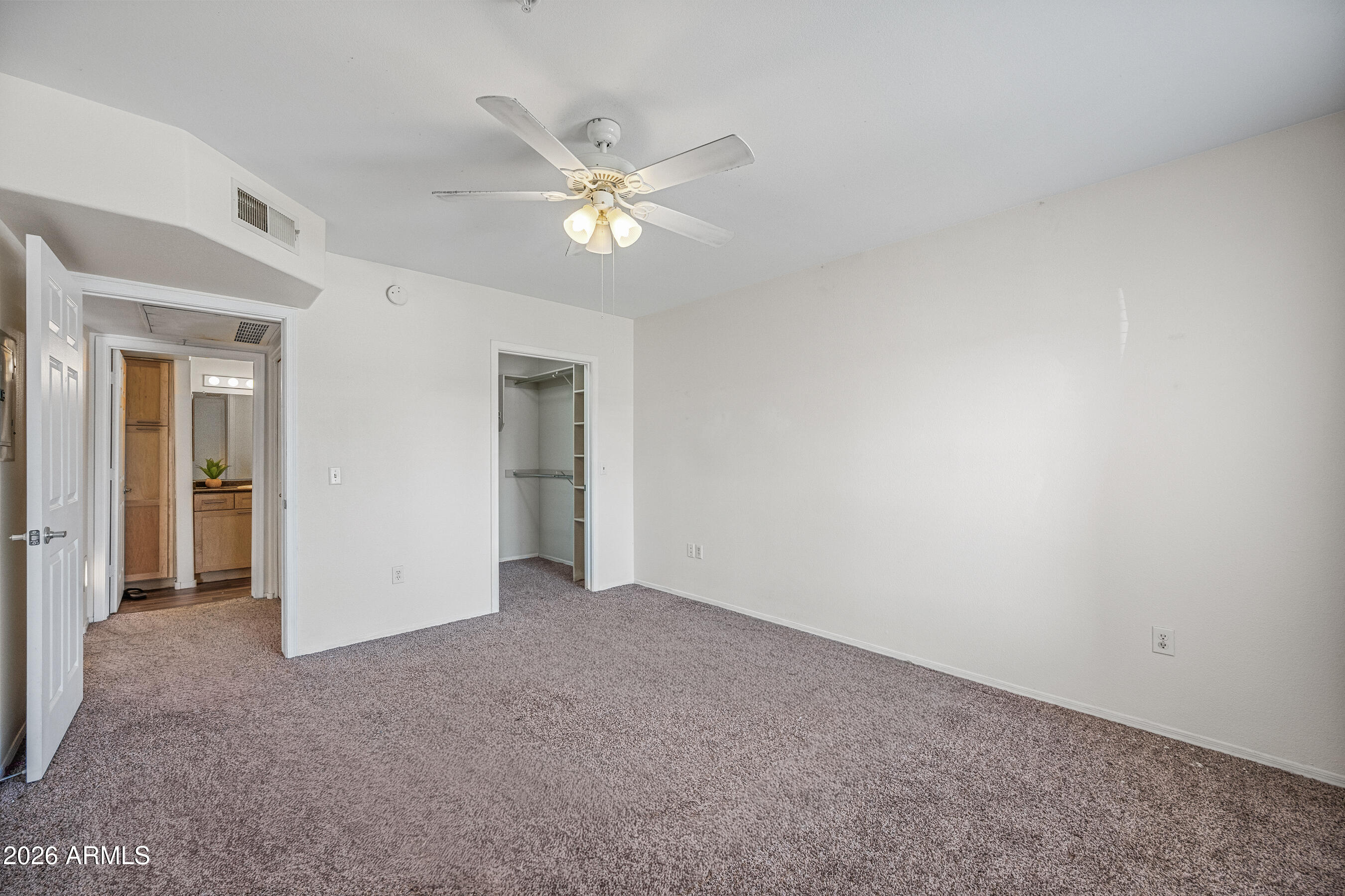 1295 North Ash Street, Unit 617 Gilbert, AZ 85233 - Photo 11 of 21 a view of an empty room with a fan