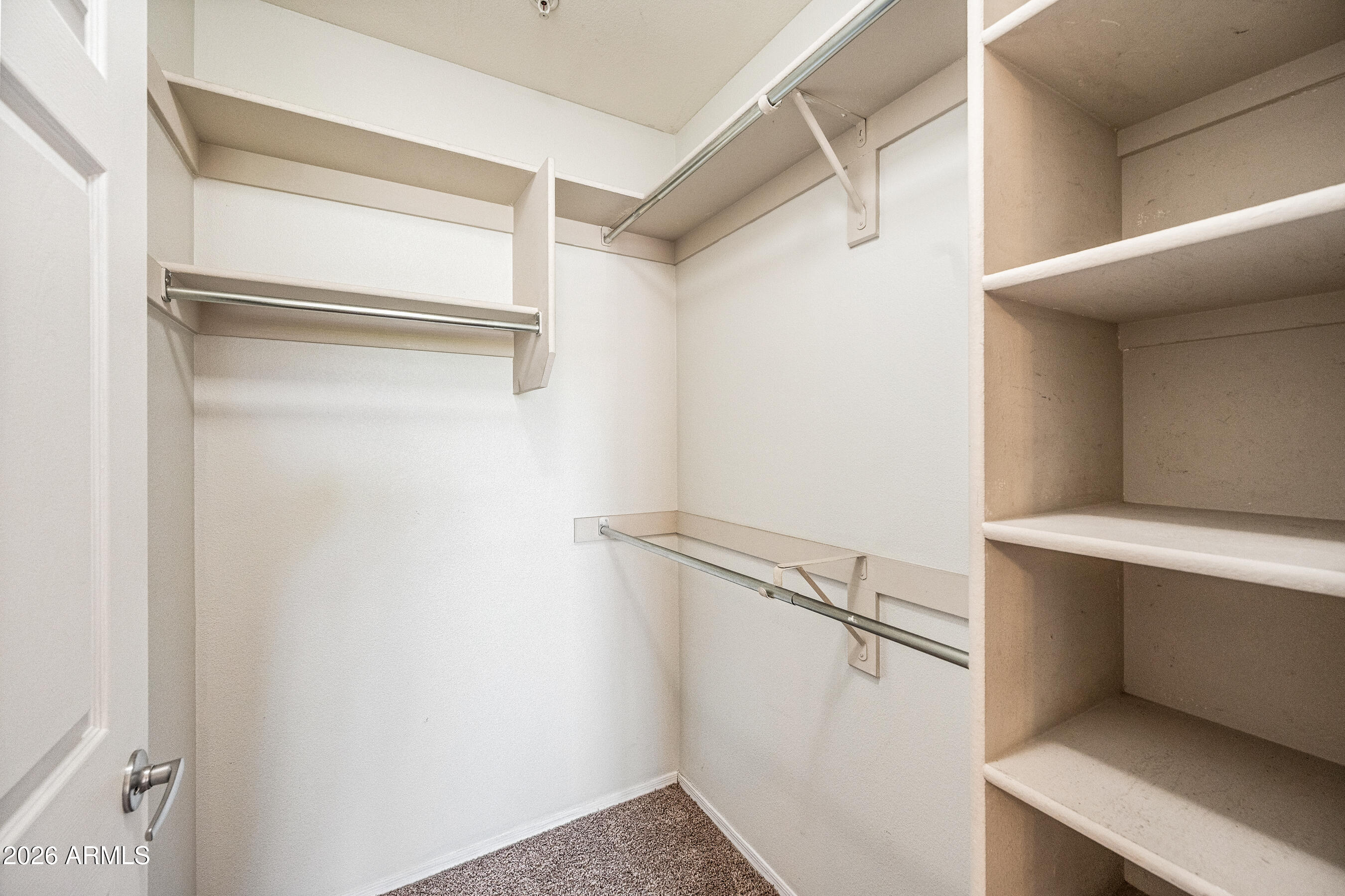1295 North Ash Street, Unit 617 Gilbert, AZ 85233 - Photo 13 of 21 a view of walk in closet with empty racks