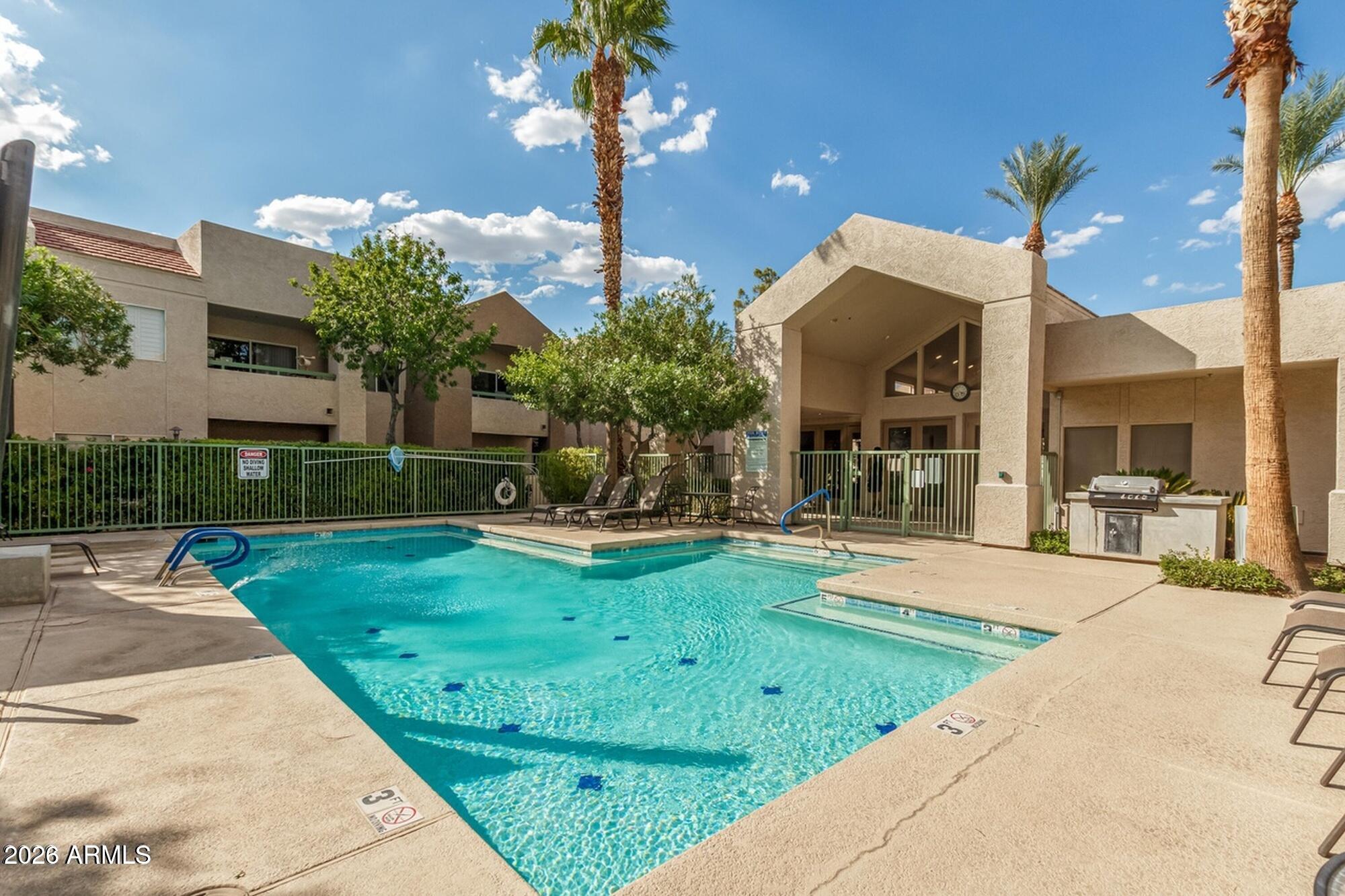 1295 North Ash Street, Unit 617 Gilbert, AZ 85233 - Photo 16 of 21 a view of a house with backyard porch and sitting area