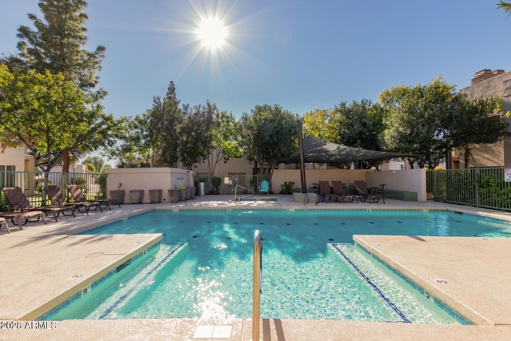 1295 North Ash Street, Unit 617 Gilbert, AZ 85233 - Photo 17 of 21 a view of a backyard with sitting area
