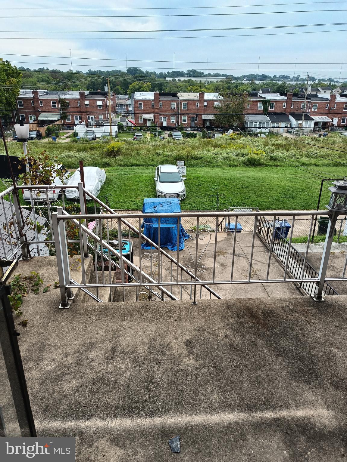 5013 Schaub Avenue Baltimore, MD 21206 - Photo 3 of 7 a view of a garden with a bench