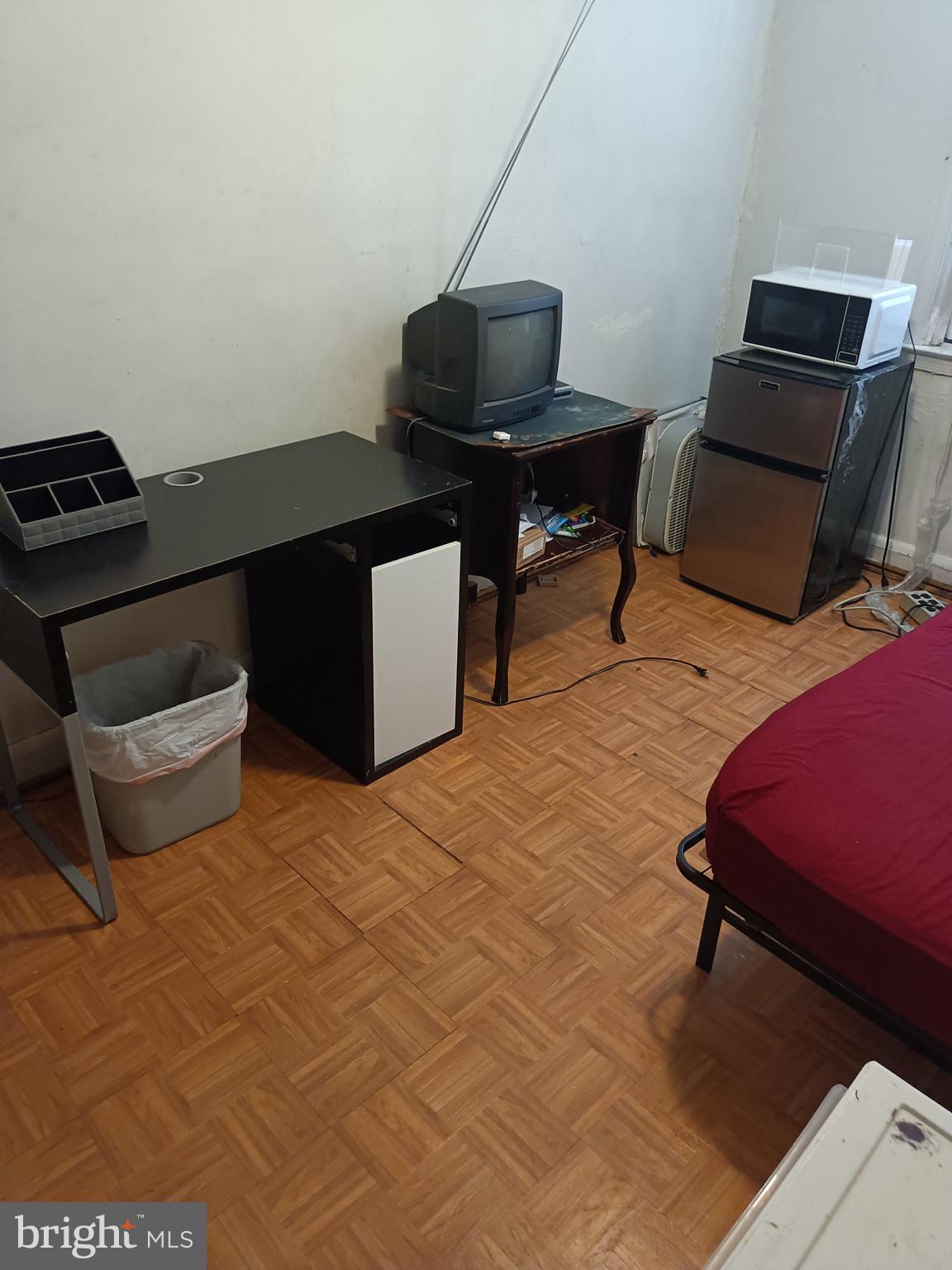 5013 Schaub Avenue Baltimore, MD 21206 - Photo 7 of 7 a living room with furniture and a flat screen tv