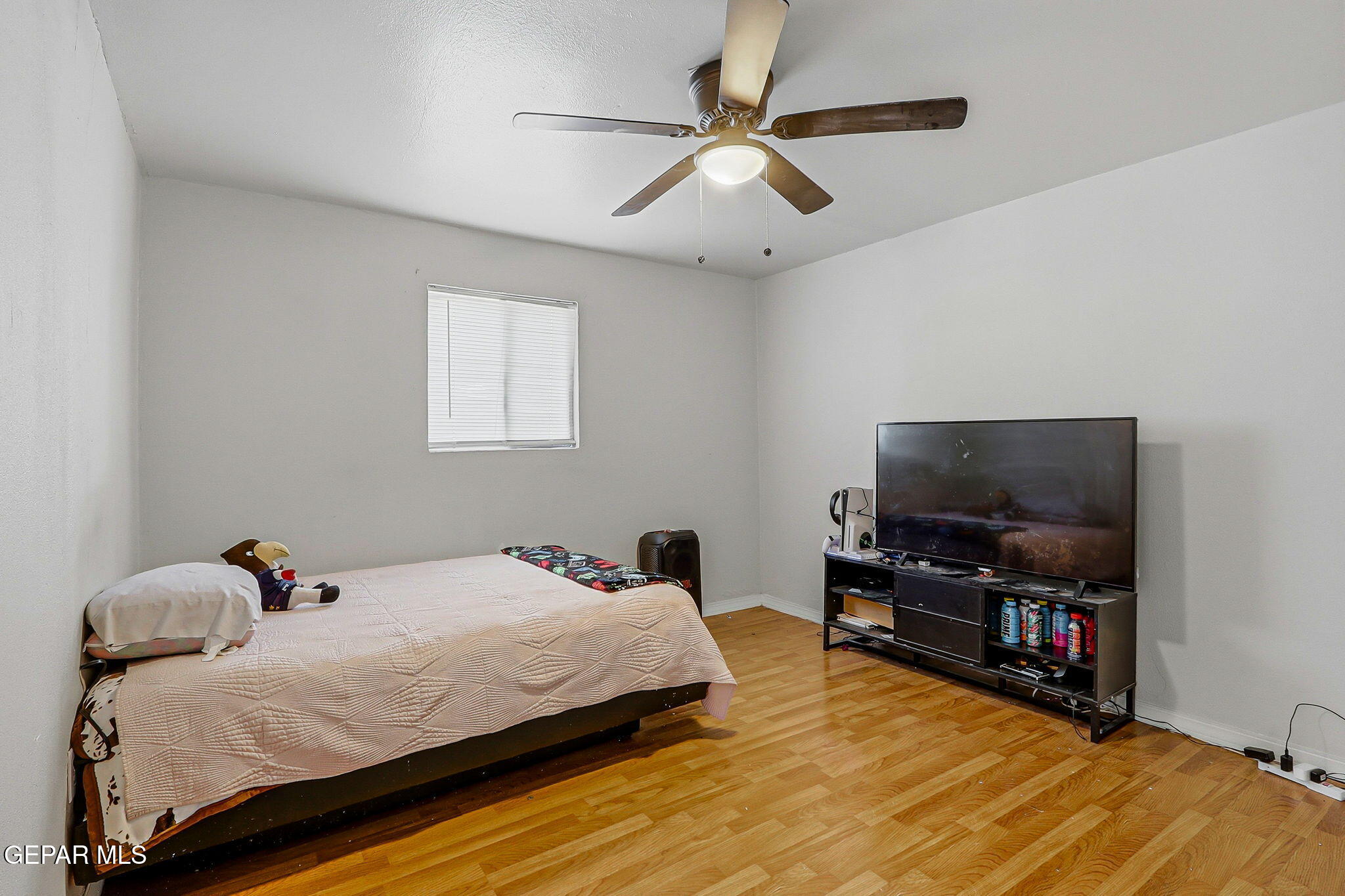 10540 Socorro Road Socorro, TX 79927 - Photo 13 of 45 a bedroom with a bed and a flat screen tv