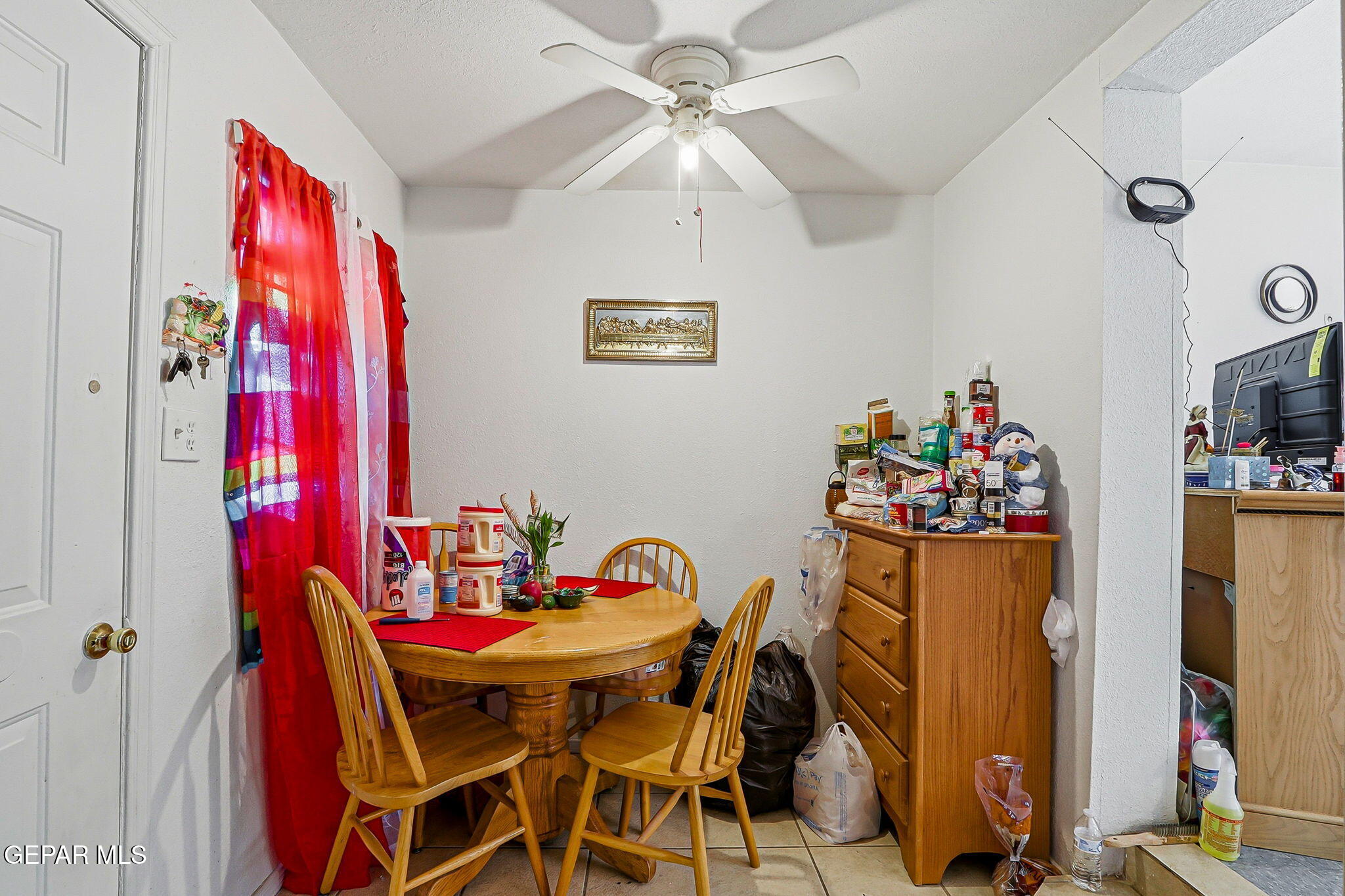 10540 Socorro Road Socorro, TX 79927 - Photo 19 of 45 a view of a dining room with furniture and chandelier