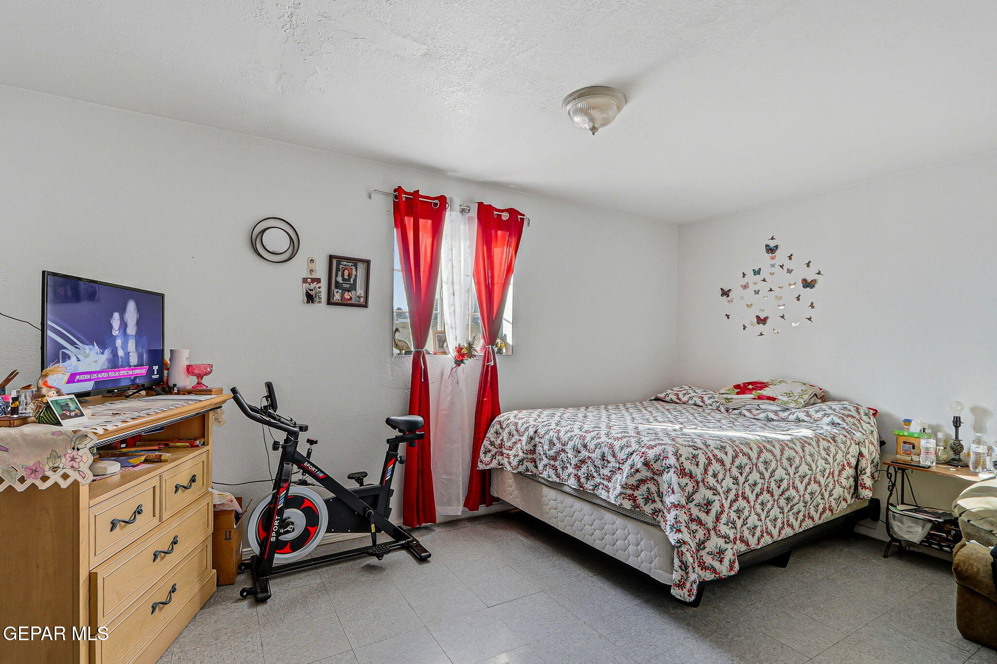 10540 Socorro Road Socorro, TX 79927 - Photo 22 of 45 a bedroom with a bed and a window