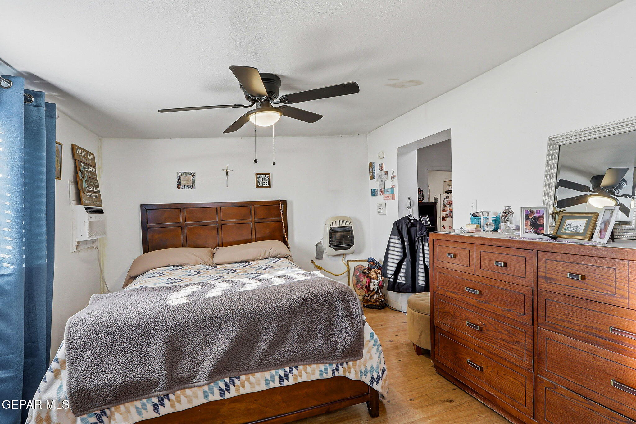 10540 Socorro Road Socorro, TX 79927 - Photo 32 of 45 a bedroom with a bed and a mirror on the dresser