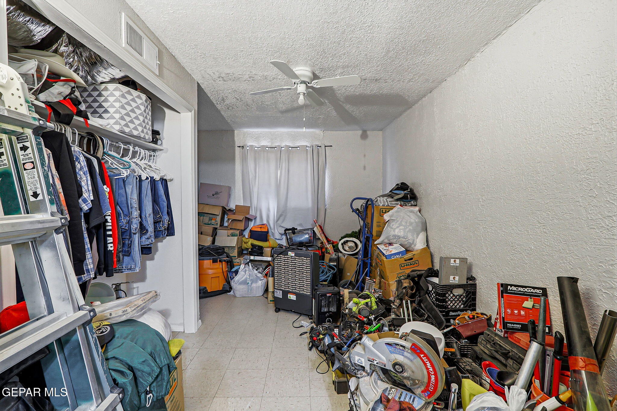 10540 Socorro Road Socorro, TX 79927 - Photo 37 of 45 a view of a storage room with a lot of stuff