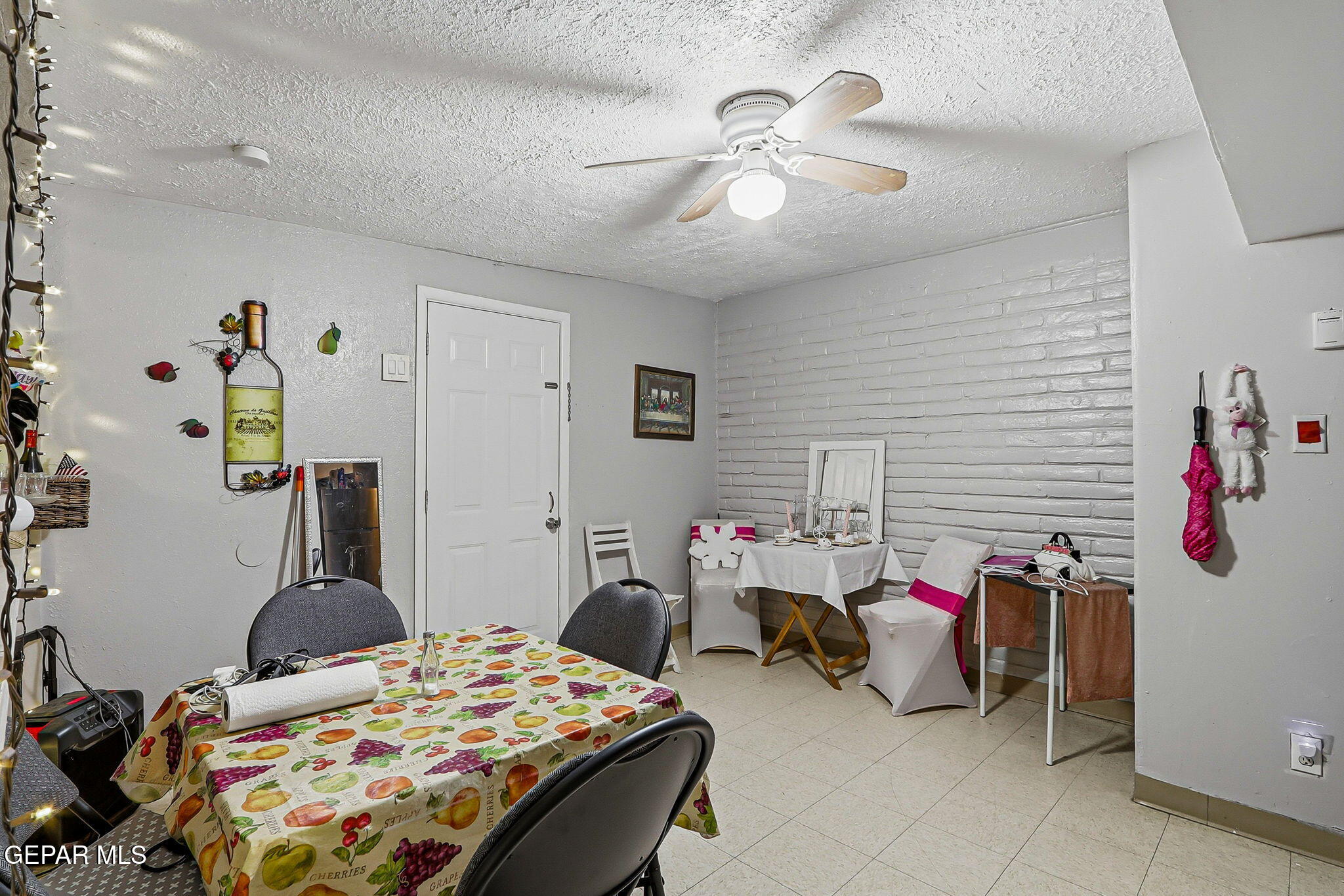 10540 Socorro Road Socorro, TX 79927 - Photo 38 of 45 a bedroom with bed and a chandelier