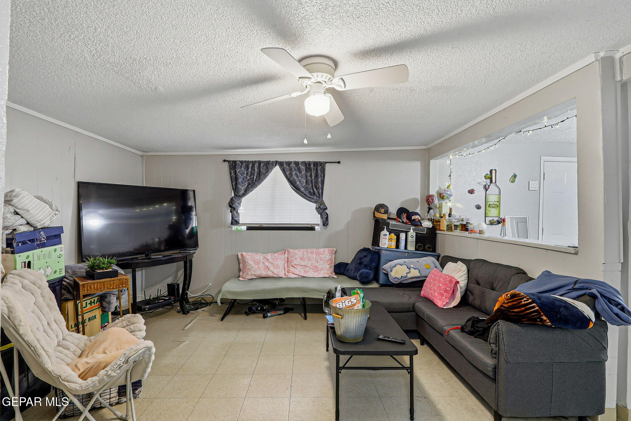 10540 Socorro Road Socorro, TX 79927 - Photo 40 of 45 a living room with furniture and a flat screen tv