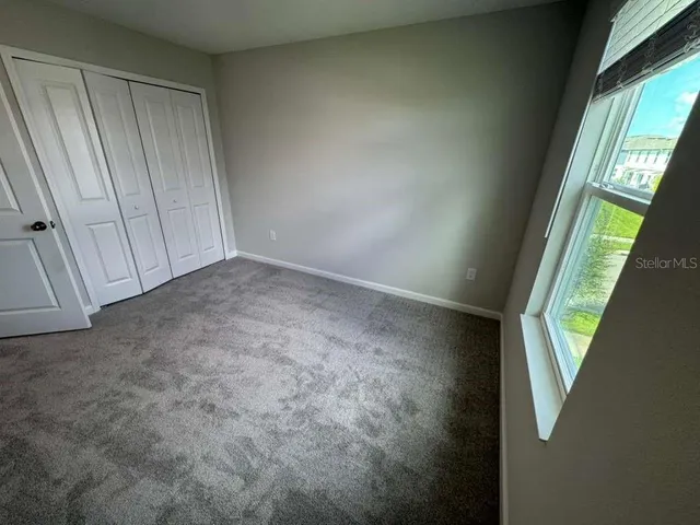 a bathroom with a double vanity sink toilet mirror and bathtub