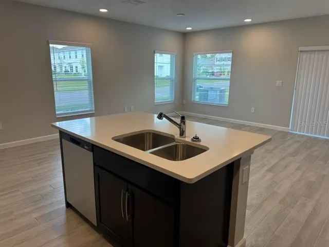 a kitchen that has a sink and a window