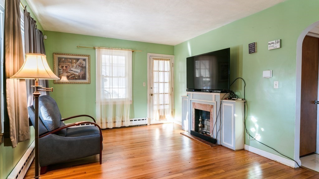 181 Laurelton Street Springfield, MA 01109 - Photo 5 of 17 a living room with furniture and a flat screen tv