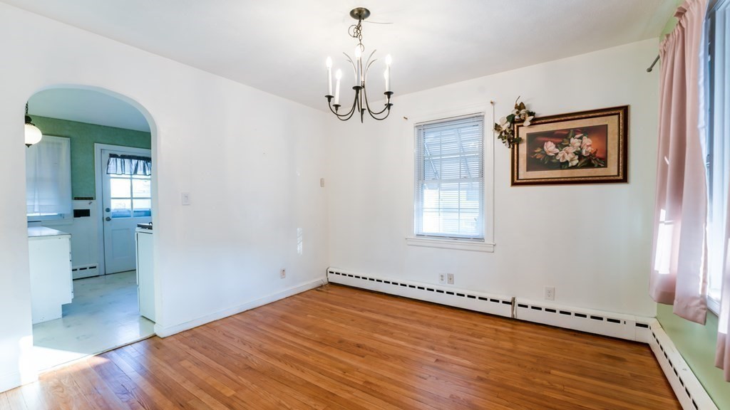 181 Laurelton Street Springfield, MA 01109 - Photo 7 of 17 wooden floor in an empty room with a window