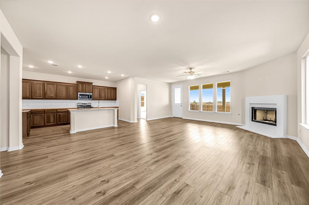 3516 Columbus Street Gainesville, TX 76240 - Photo 11 of 40 a view of a kitchen with a sink stove cabinets and empty room