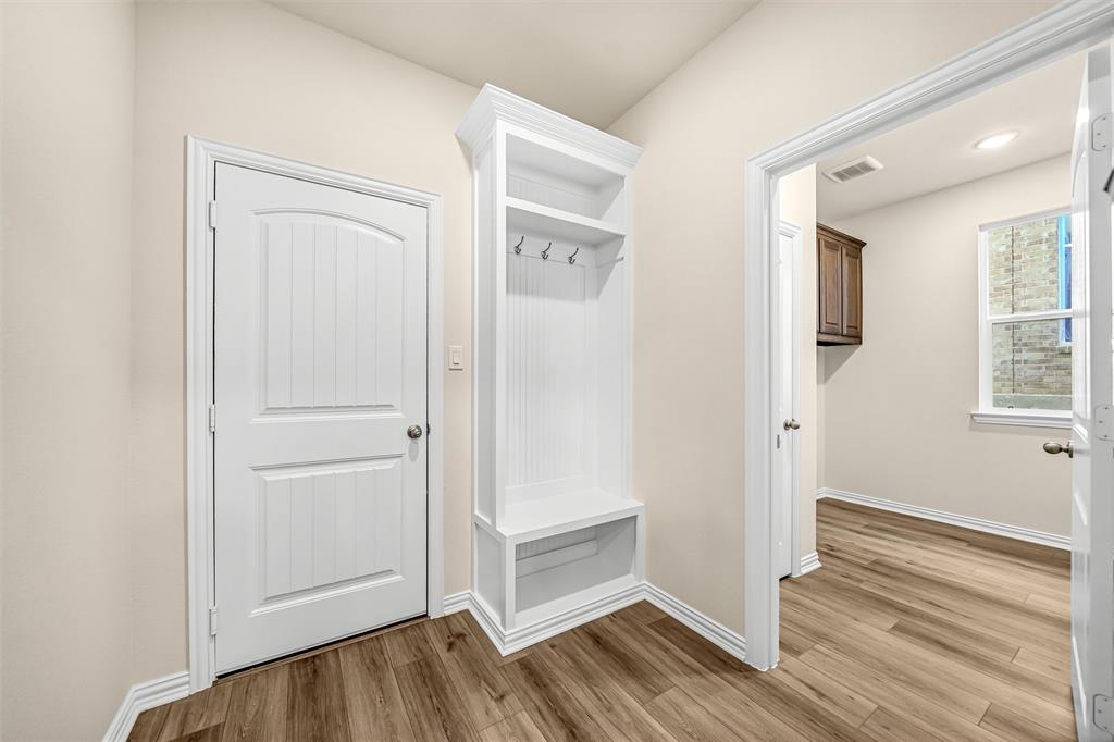 3516 Columbus Street Gainesville, TX 76240 - Photo 22 of 40 a view of an empty room window and wooden floor