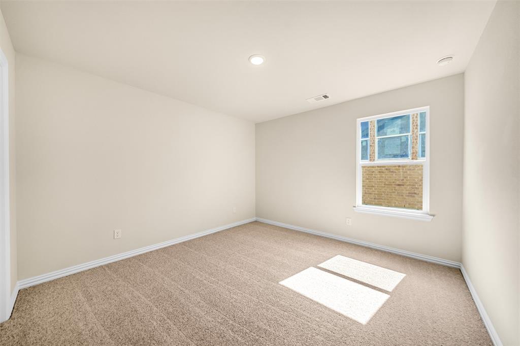 3516 Columbus Street Gainesville, TX 76240 - Photo 29 of 40 an empty room with a window