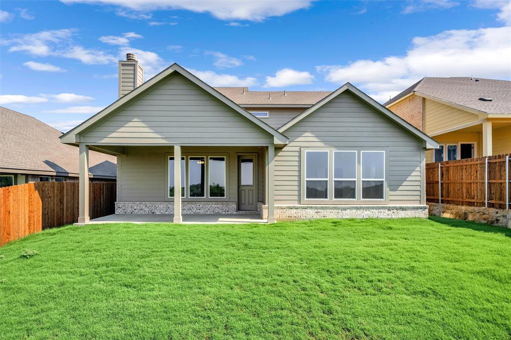 3516 Columbus Street Gainesville, TX 76240 - Photo 36 of 40 a front view of a house with a yard