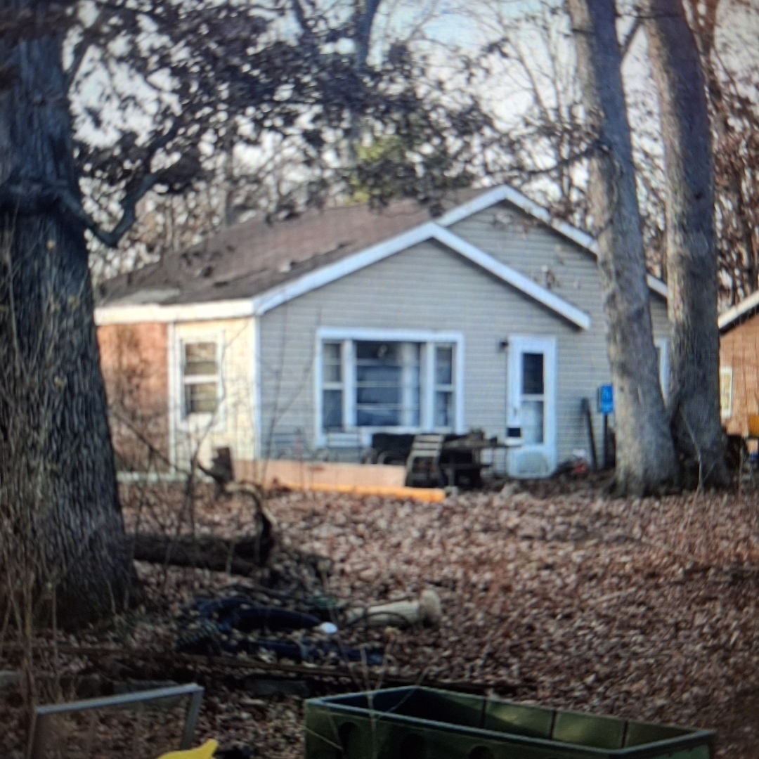 a front view of house with yard outdoor seating and yard