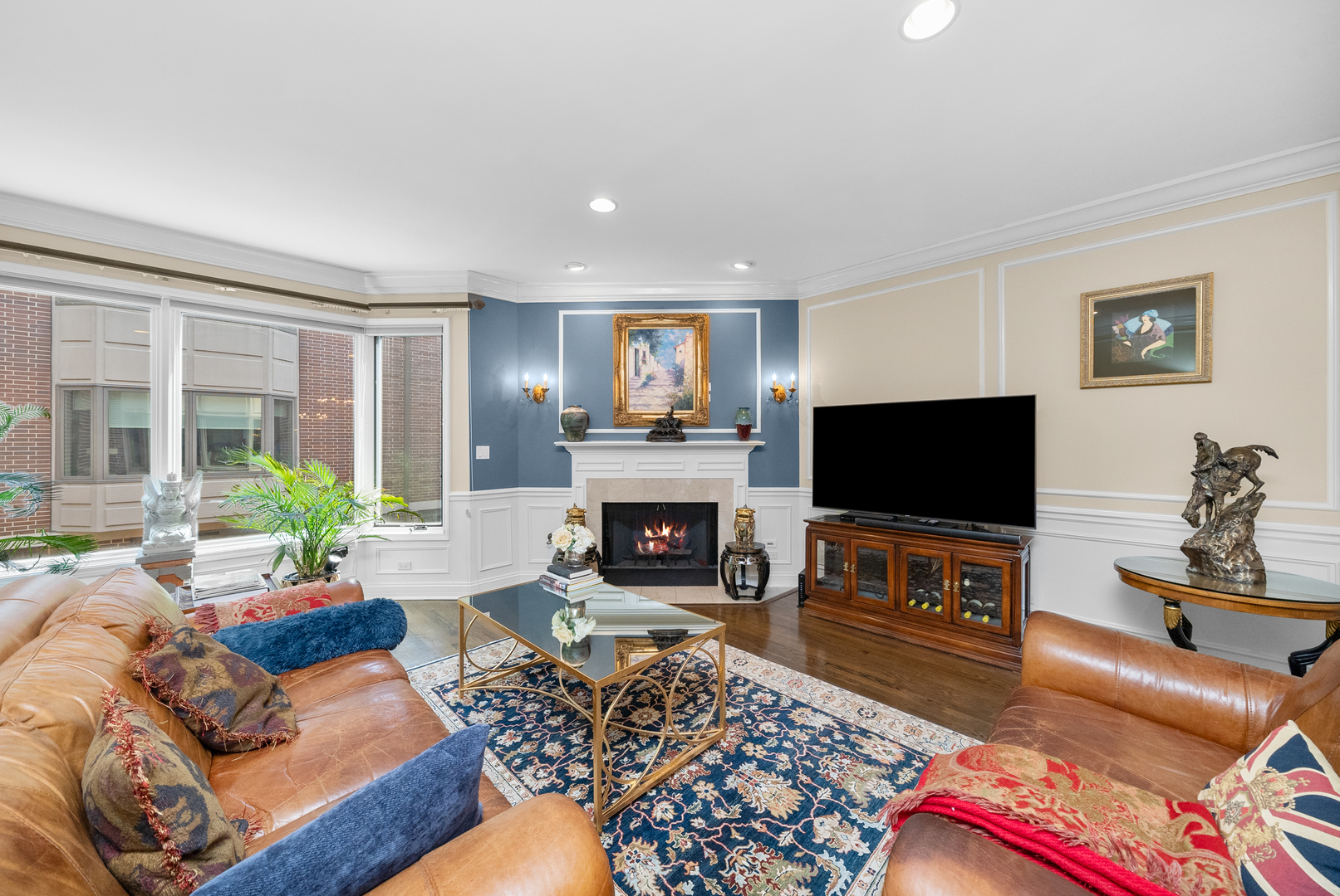 55 West Goethe Street, Unit 1222 Chicago, IL 60610 - Photo 14 of 43 a living room with furniture a flat screen tv and a fireplace