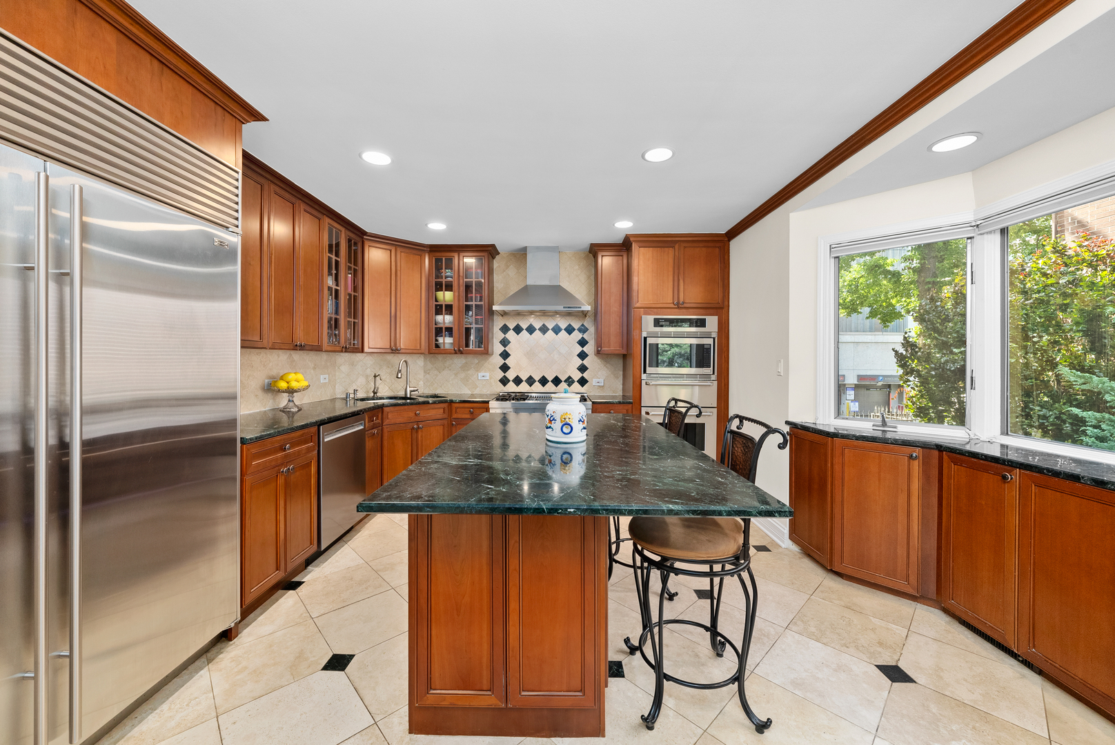 55 West Goethe Street, Unit 1222 Chicago, IL 60610 - Photo 2 of 43 a kitchen with stainless steel appliances granite countertop a stove a sink and a refrigerator
