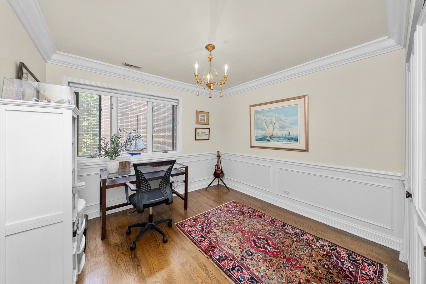 55 West Goethe Street, Unit 1222 Chicago, IL 60610 - Photo 26 of 43 a workspace with wooden floor and a rug