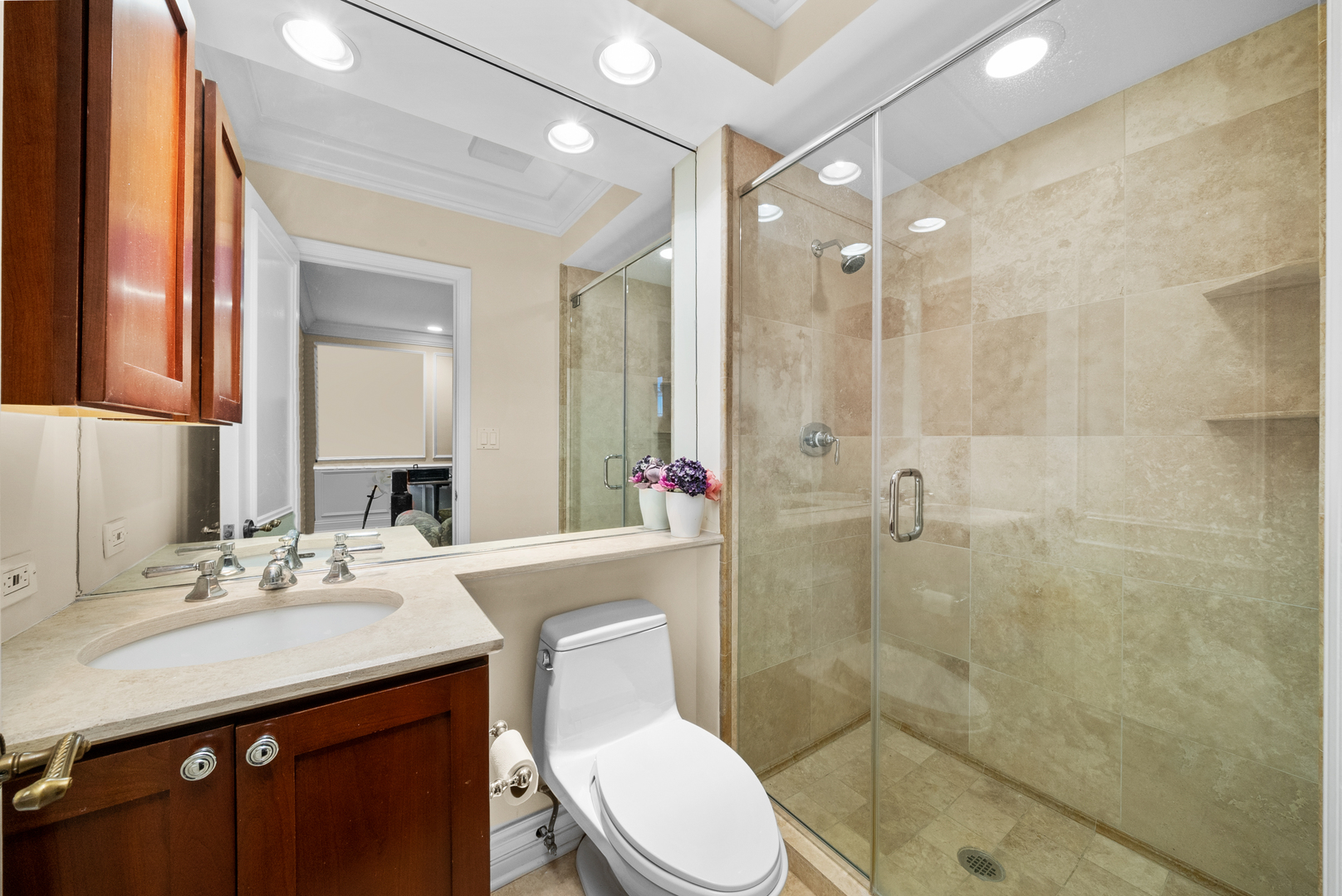 55 West Goethe Street, Unit 1222 Chicago, IL 60610 - Photo 32 of 43 a bathroom with a sink toilet a mirror and shower