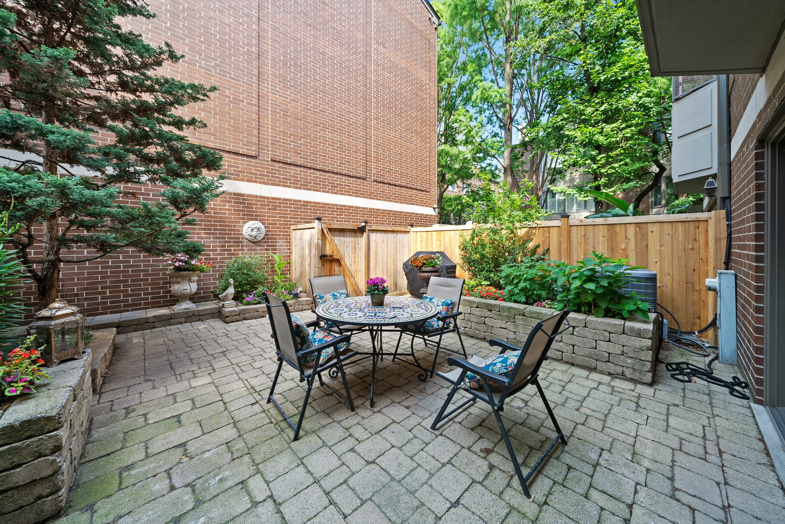 55 West Goethe Street, Unit 1222 Chicago, IL 60610 - Photo 36 of 43 a view of chair and tables in the backyard