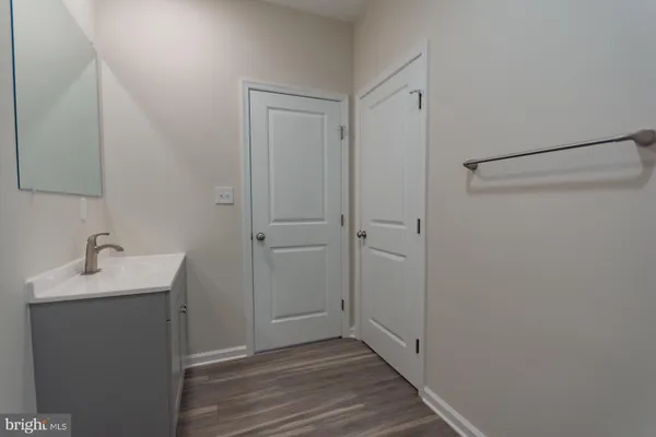 a bathroom with a sink and mirror
