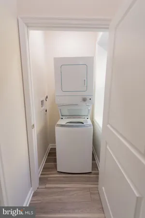 a view of a hallway with washer and dryer