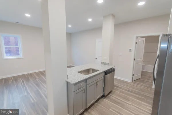 a bathroom with a sink and a large mirror